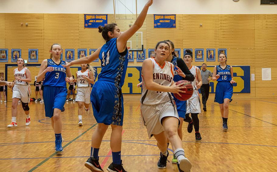 Izzy Smith goes in for a lay-up during a Division III semifinal game between Brussels and Spangdahlem at Wiesbaden High School, Germany, Friday, Feb. 22, 2019. Spangdahlem won the game 46-21. 