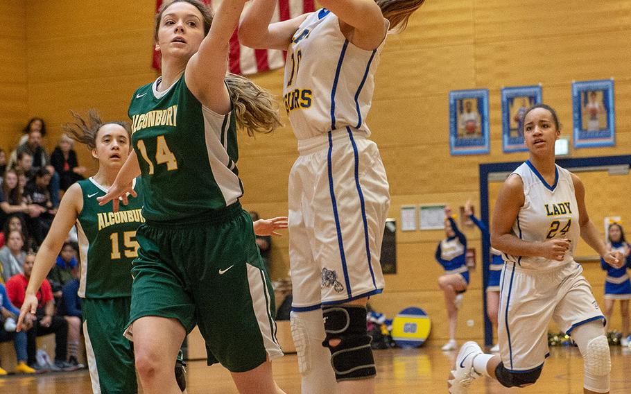 Sigonella's Emma Taylor is fouled shooting a three-pointer during a Division III semifinal game between Sigonella and Alconbury at Wiesbaden High School, Germany, Friday, Feb. 22, 2019. Sigonella won the game 36-31.