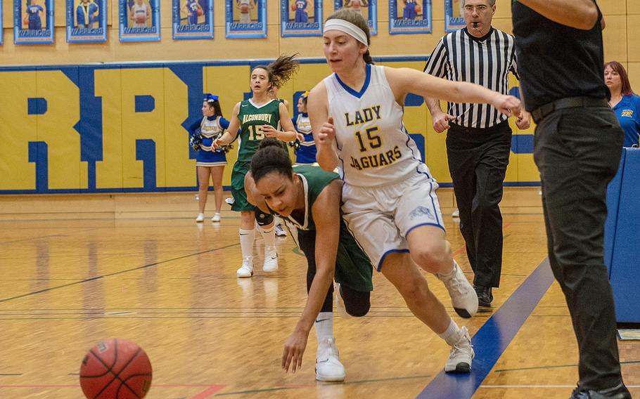 Sigonella's Jessica Jacobs wins a battle for the ball during a Division III semifinal game between Sigonella and Alconbury at Wiesbaden High School, Germany, Friday, Feb. 22, 2019. Sigonella won the game 36-31.