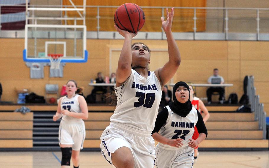 Bahrain's Yamina Tesch finishes off a fast break in a girls Division II semifinal at the DODEA-Europe basketball championships in Wiesbaden, Germany. AOSR won the game 35-27 to advance to Saturday's final against AFNORTH.