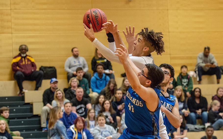 Baumholder's Stephen Christmas goes up for a lay-up during a Division III semifinal basketball game between Baumholder and Brussels at Wiesbaden High School, Germany, Friday, Feb. 22, 2019. Baumholder won the game 80-46.