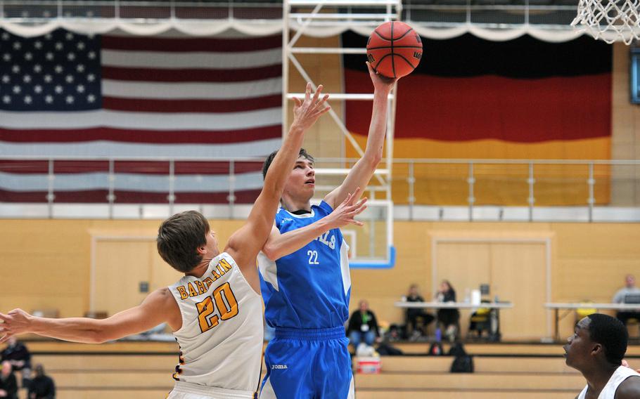 Marymount's Francesco Gnecco takes a shot against Bahrain's Peter Curling in a Division II semifinal at the DODEA-Europe basketball championships in Wiesbaden, Germany. Bahrain won 63-40 and advances to Saturday's final.









