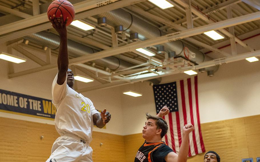 Ansbach's Kevin Kamara goes up for a shot during a Division III semifinal game between Spangdahlem and Ansbach at Wiesbaden High School, Germany, Friday, Feb. 22, 2019. Ansbach won the game 66-26.