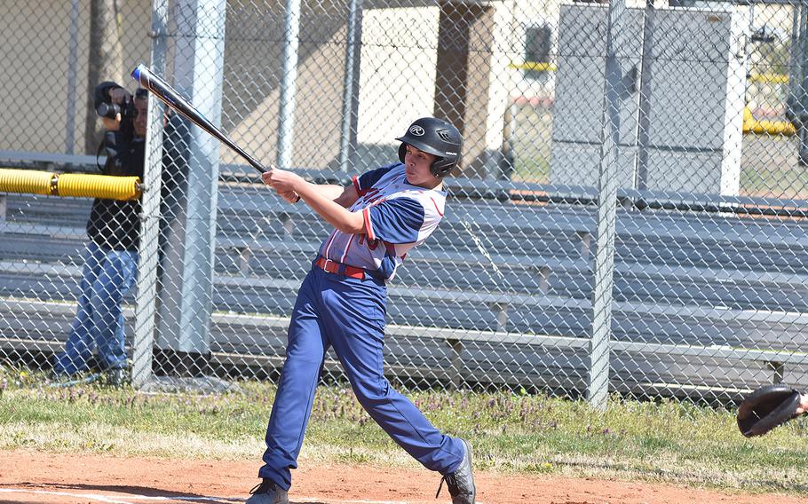 Aviano's Gabe Retamoza drills a triple during the Saints' 16-1 victory over Ansbach on Friday, March 29, 2019.
