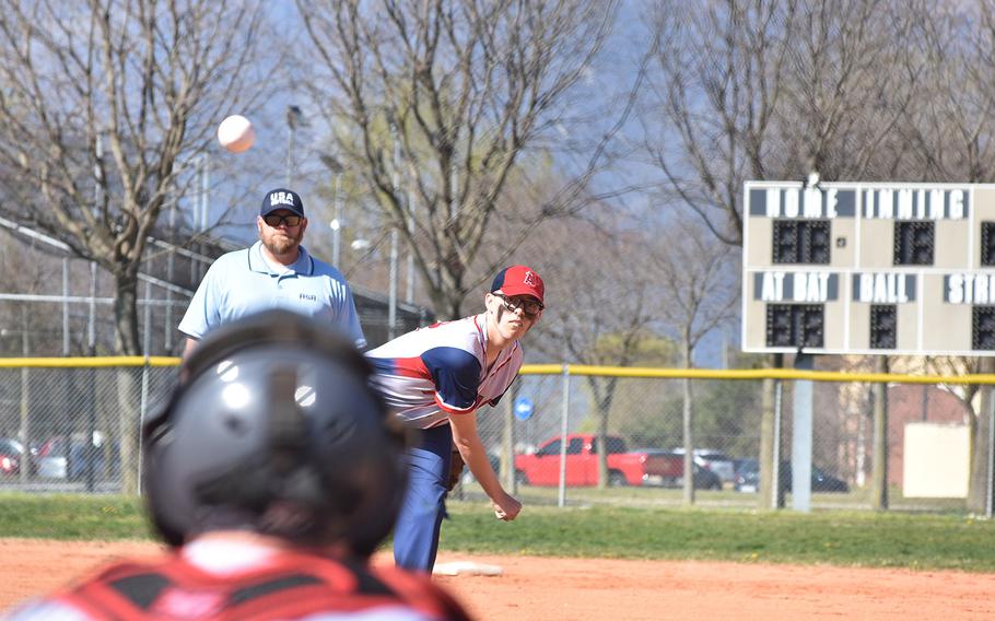 Aviano's Payne Varnum fires a pitch towards catcher Nick Smith in the Saints' 16-1 victory over Ansbach on Friday, March 29, 2019.
