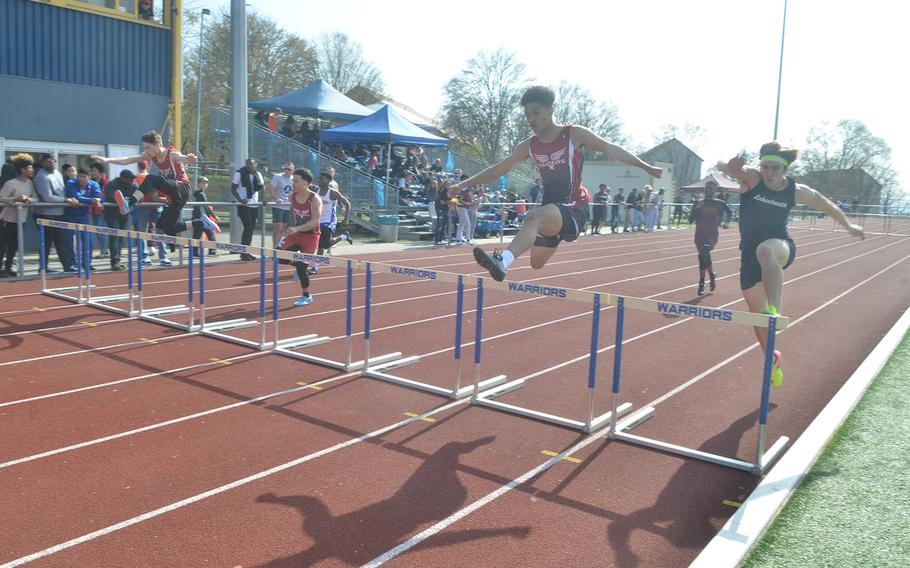 Competitors race in the boys 300-meter hurdle race at Wiesbaden High School, Saturday, March 30, 2019. The race was part of a 13-school track and field meet - the first of the 2019 season.