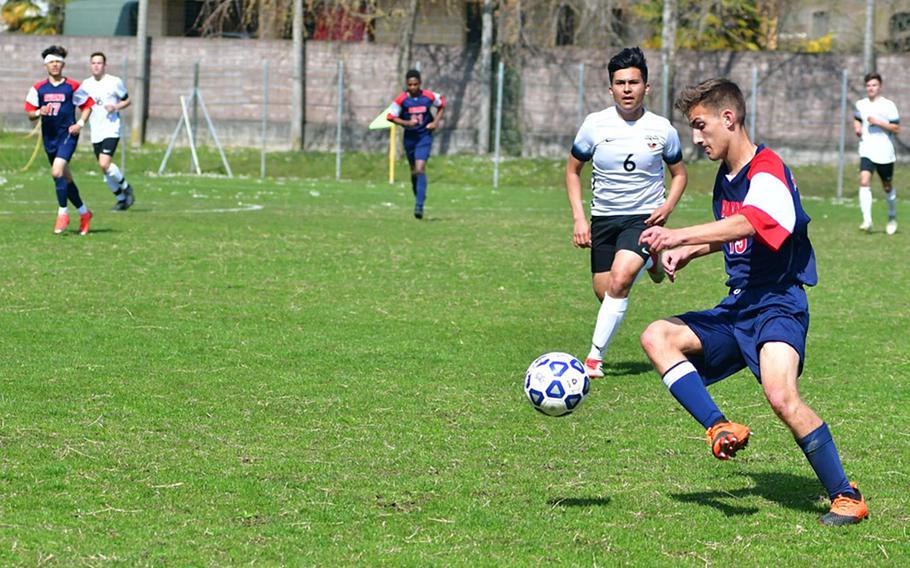 Noah Page of the Aviano Saints tries to break away from Stuttgart defender Will Bermudez during Saturday's game that was played at the Aviano stadium.