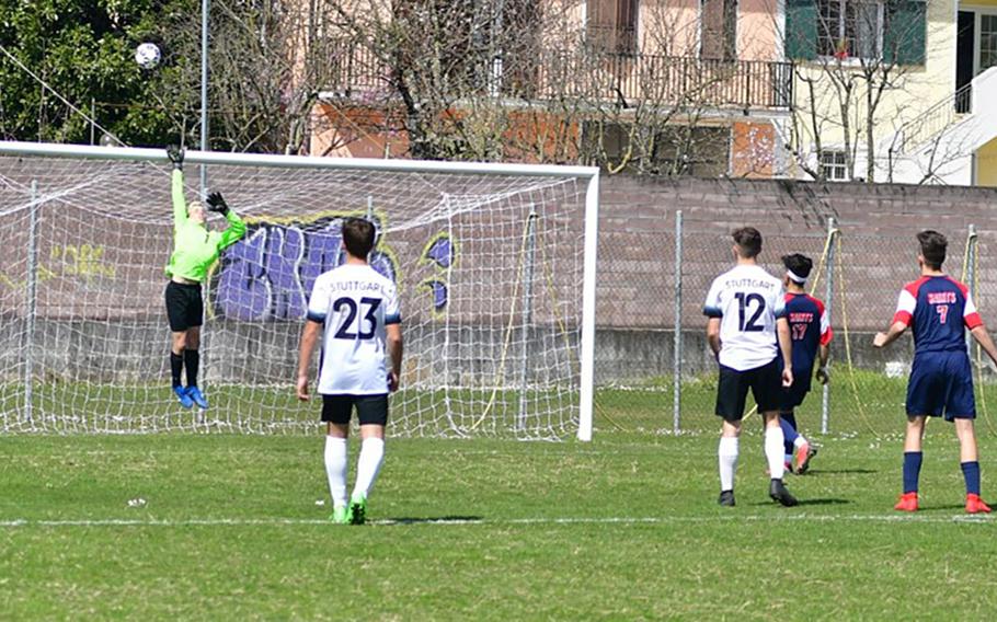 Jack Engelke of the Stuttgart Panthers jumps in an attempt to save a shot from Aviano's Jason Valladares during Saturday's game that was played at the Aviano stadium. Stuttgart won the game 2-0.  