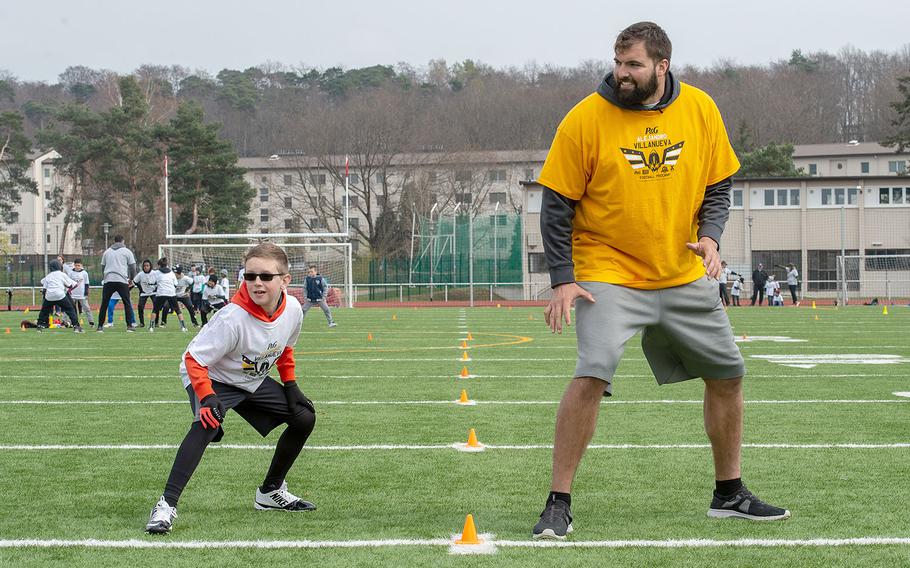 Pittsburg Steelers offensive lineman Alejandro Villanueva participates in drills with the kids during a pro camp at Kaiserslautern High School football field Saturday, April 13, 2019. More than 200 kids from around Germany attended the two-day football camp.