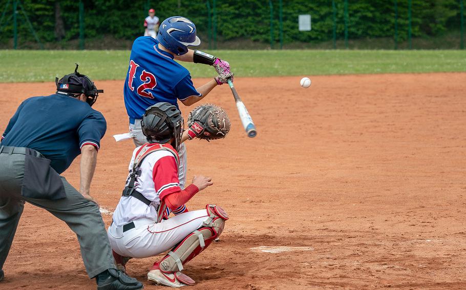 Ramstein's Nathan Kranz hits a fly ball to right field during a game between Kaiserslautern and Ramstein High Schools, Saturday, May 18, 2019, at Kapaun Air Station, Germany.