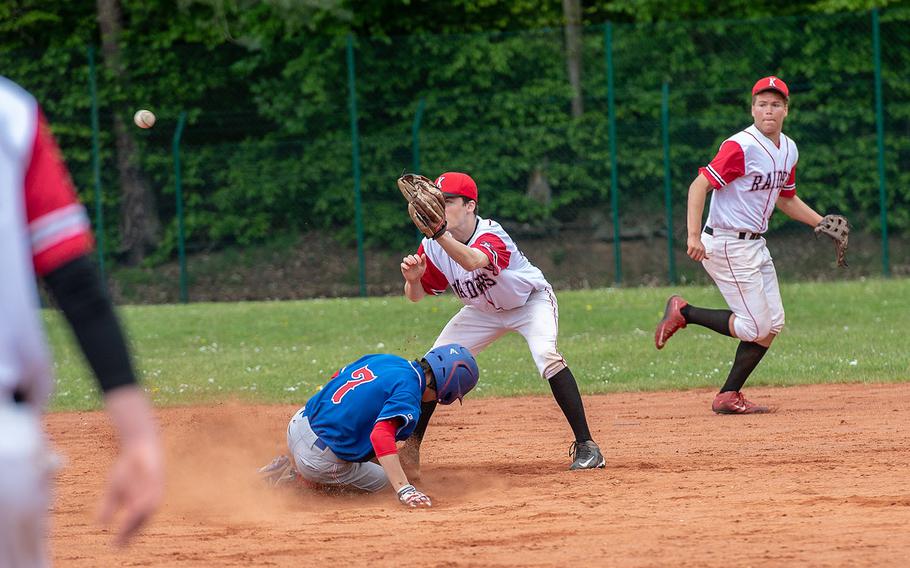 Ramstein's Jeremy LeClair beats a throw as he steals second base during a game between Kaiserslautern and Ramstein High Schools, Saturday, May 18, 2019, at Kapaun Air Station, Germany. 