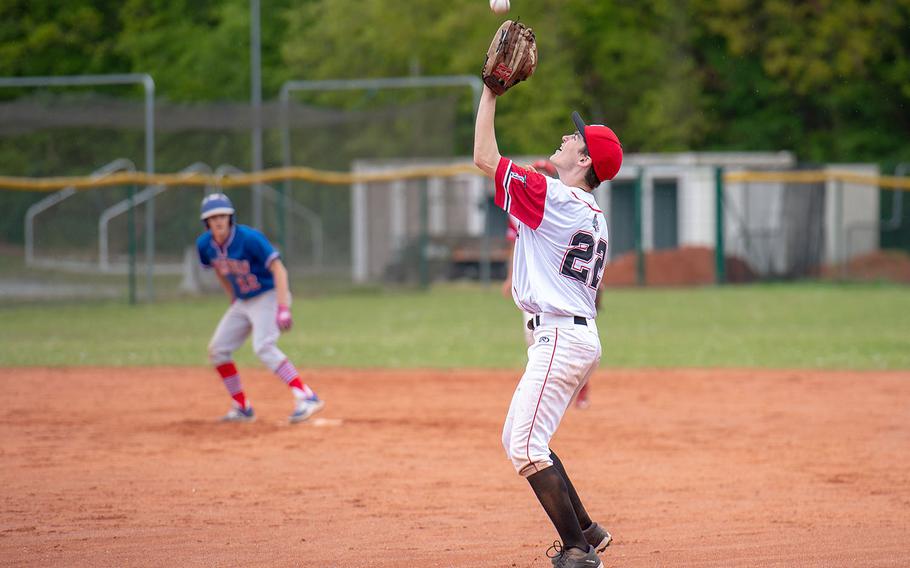 Kaiserslautern's Randy Moon catches a fly ball during a game between Kaiserslautern and Ramstein High Schools, Saturday, May 18, 2019, at Kapaun Air Station, Germany. 