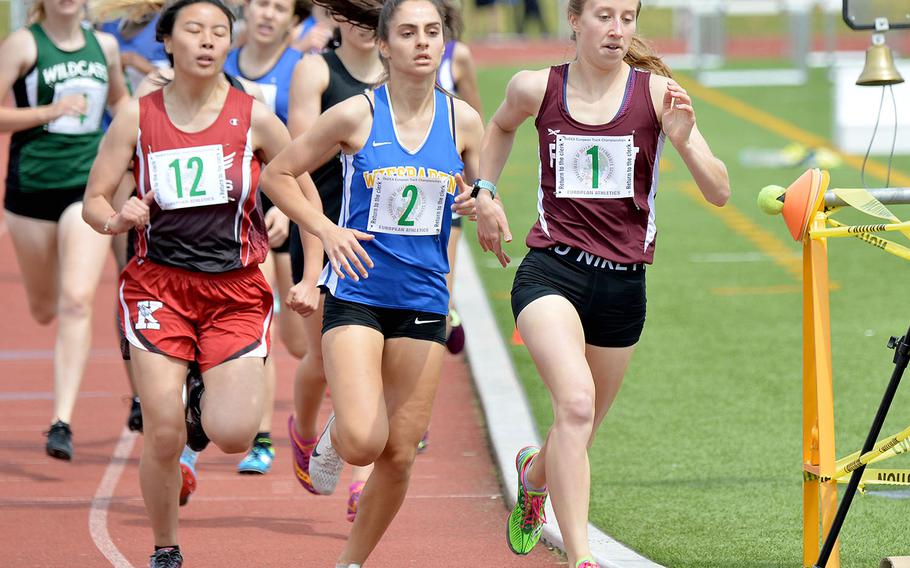 Frankfurt International's Gracie Wells leads Wiesbaden's Myriam Friel and Kaiserslautern's Sarah Buzard into the last lap of the 800-meter race at the DODEA-Europe track and field championships in Kaiserslautern. Wells won the race in 2 minutes, 23.7 seconds ahead of Fried. Buzard finished 12th.