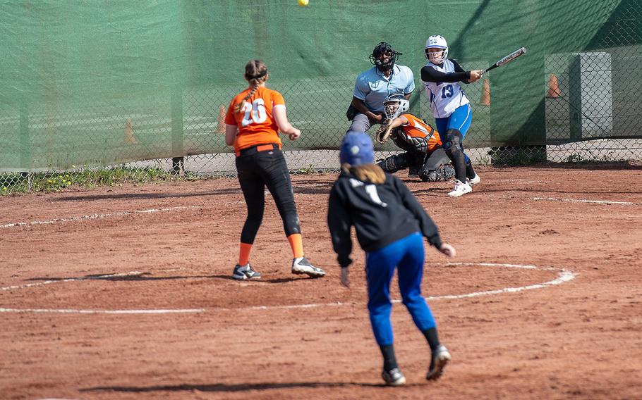 Rota's Emma Bond hits a fly ball during a game against Spangdahlem on Day 2 of the girls Division II/III DODEA-Europe softball championships, Friday, May 24, 2019. 