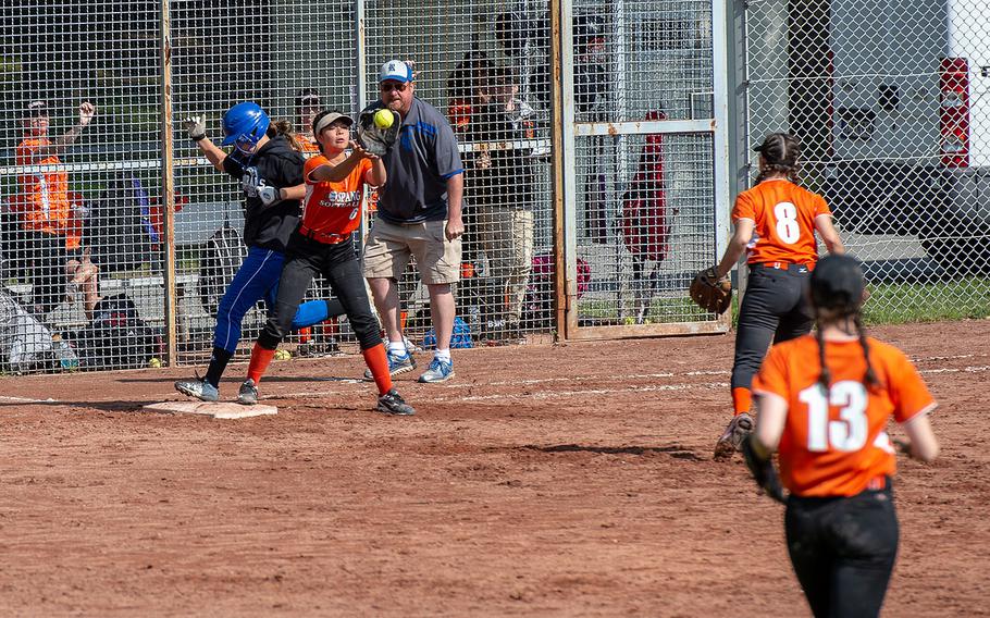 Spangdahlem's Arianna Peric catches the trow to first base during a game against Rota on Day 2 of the girls Division II/III DODEA-Europe softball championships, Friday, May 24, 2019. 