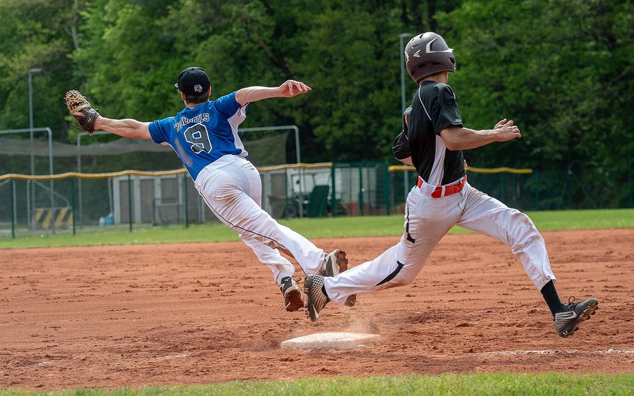 Spangdahlem's Carson Hicks beats a throw to first as Hohenfels' Julian Symkowick comes off the bag to get the ball during a game on Day 2 of the boys Division II/III DODEA-Europe baseball championships, Friday, May 24, 2019. 