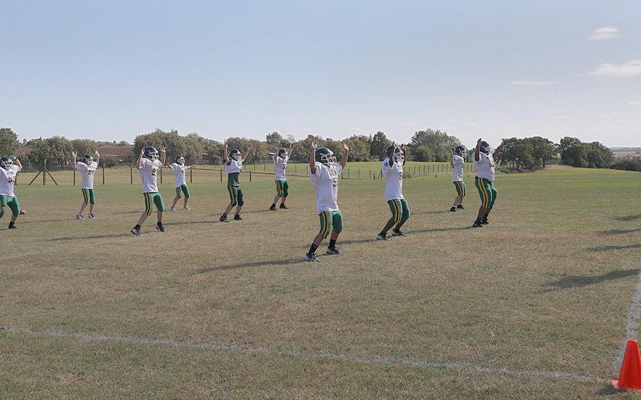 Members of the Alconbury Dragons warm up for practice Tuesday Sept. 3, 2019 on RAF Alconbury.
