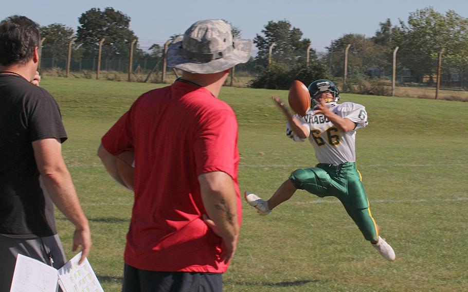 An Alconbury Dragon football player attempts to catch a pass during practice Tuesday Sept. 3, 2019 on RAF Alconbury.