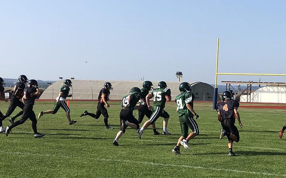 AFNORTH players pursue a Spangdahlem ballcarrier in a preseason scrimmage Saturday, Aug. 31, 2019, at Spangdahlem Air Base, Germany.