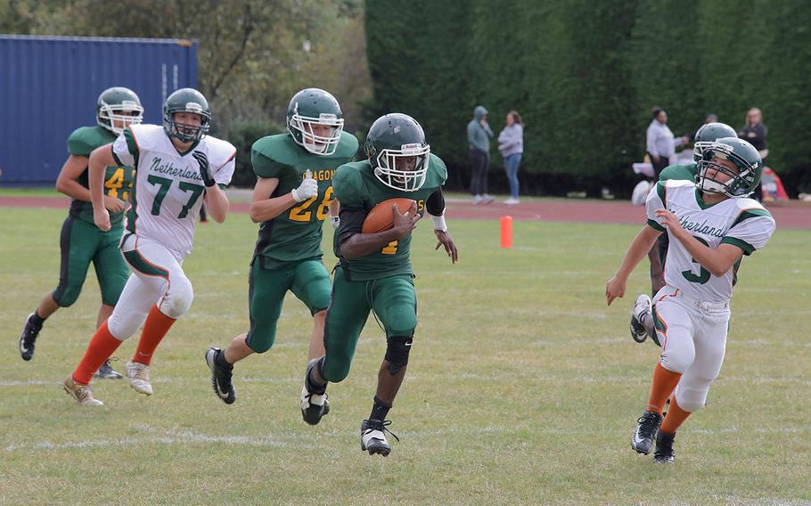Alconbury's Tye Tre'von runs 80 yards in a kickoff return to get a touchdown in the begining of the third quarter to give the Dragons the lead 19-18 at RAF Alconbury, England, on Saturday, Sept. 7, 2019.