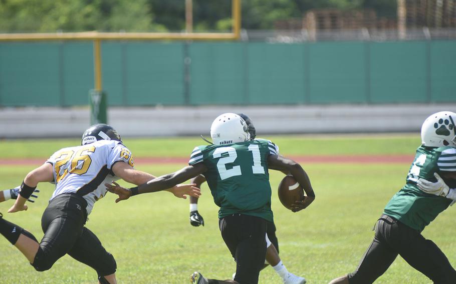 Wildcat Tigus Hunter runs downfield before Cougars defenders catch him on Saturday, Sept. 7, 2019 at Naples Middle High School. The Wildcats beat the Cougars 26-6.