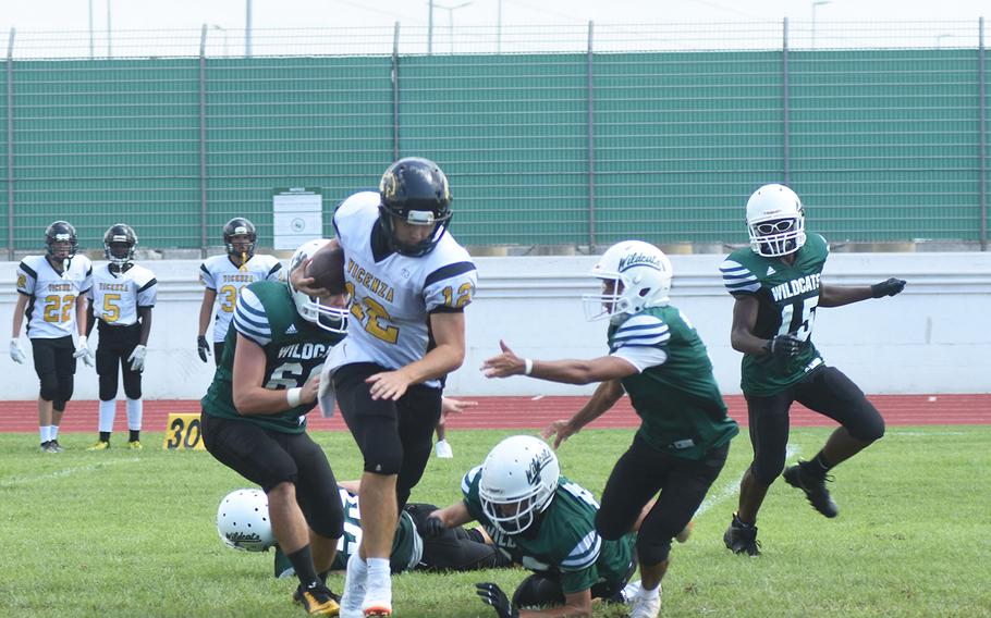 Cougars quarterback Lucas Ridgely breaks several tackles from smaller Wildcats on Saturday, Sept. 7, 2019 at Naples Middle High School. Ridgely proved more effective at running than passing -- throwing five interceptions -- but despite his efforts, the Wildcats beat the Cougars 26-6. 