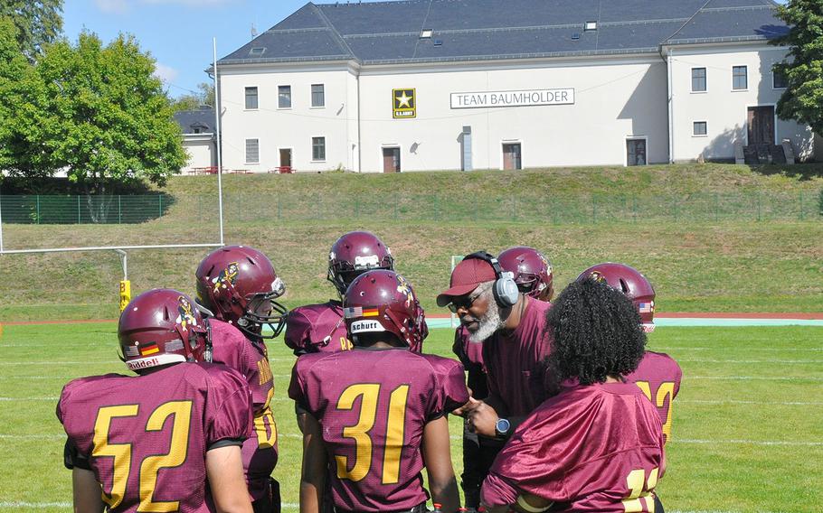 Baumholder coach Phillip Loyd addresses his team during a timeout in the Bucs' 21-12 loss to Hohenfels on Saturday, Sept. 14, 2019, at Baumholder, Germany. 