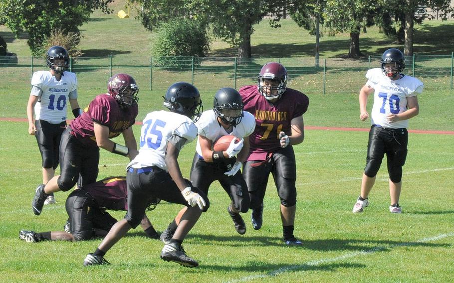 Hohenfels' Jared Wiggins carries the ball against Baumholder in Hohenfels 21-12 victory Saturday, Sept. 14, 2019, at Baumholder, Germany. 
