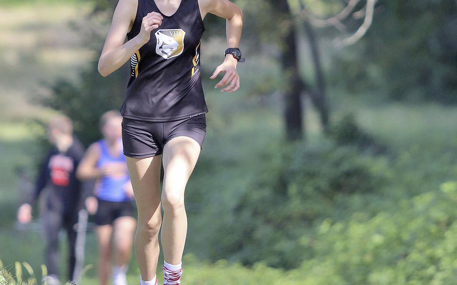 Kaley Smith of Vicenza High School crosses the finish line in third place during the cross country meet held at San Floriano Parco Rurale, Polcenigo, Italy, Saturday, Sept. 14, 2019.