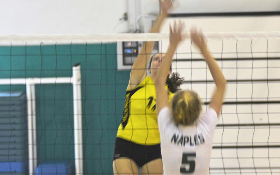 Cougar Londyn Wilson prepares to strike the ball while Wildcat Roxanne Sasse defends. Naples beat Vicenza in a five-set match on Saturday Sept. 14, 2019 at Naples Middle High School. 
