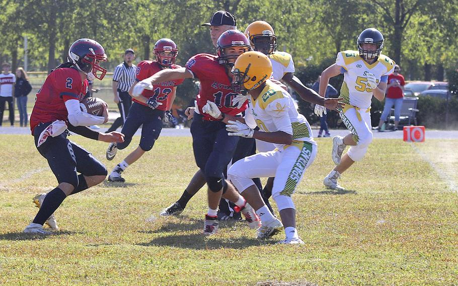 Aviano quarterback Michael Hauser runs for a first down during the Saints' 52-16 victory on Saturday, Sept. 21, 2019.