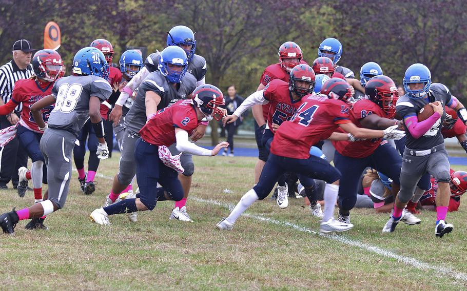 Rota Admirals running back Wes Penta runs past Aviano Saint's defenders en route to a touchdown during Saturday's game held at Aviano. 