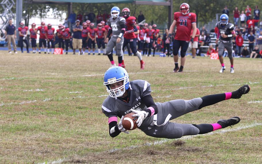 Rota wide receiver Judge Tice lays out to grab a pass for a touchdown from quarterback Campbell Lamb during Saturday's game at Aviano. The Saints won the game 24-21 and will host Naples next week in the semifinals.