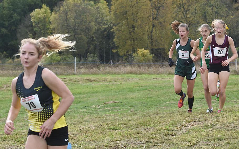 Stuttgart's McKinley Fielding jumped out to an early lead over, from left, Naples' Ariana Coats, Shape's Greta Di Dio and Frankfurt's Gracie Wetli at the DODEA-Europe cross country championships in Baumholder, Germany, on Saturday, Oct. 19, 2019. Fielding won the race and set a new course record.