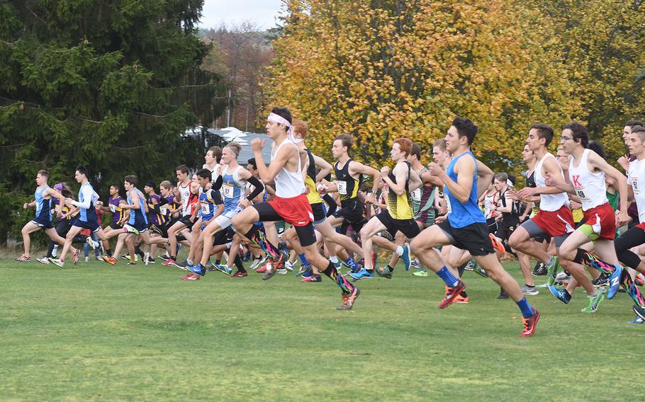 Runners sprint for position at the start of the boys race at the DODEA-Europe cross country championships on Saturday, Oct. 19, 2019, in Baumholder, Germany.

