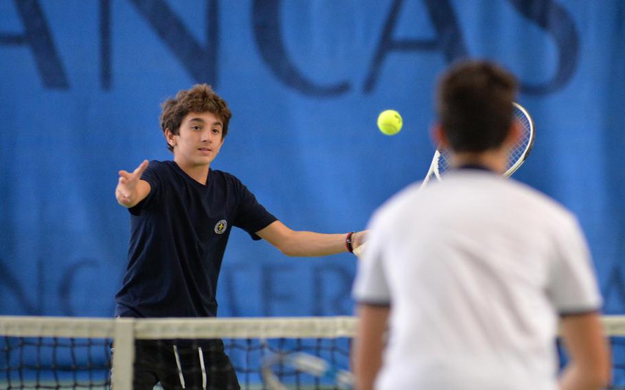 Florence's Brando Fabri-Corigliano hits the ball at the net against Marymount in a doubles semifinal at the DODEA-Europe tennis championships in Wiesbaden, Germany, Friday, Oct. 25, 2019. Fabri-Corigliano and teammate Pietro Reali advanced to the finals with a 6-4, 6-2 win over David Lopez Post and Sergio Nogales.