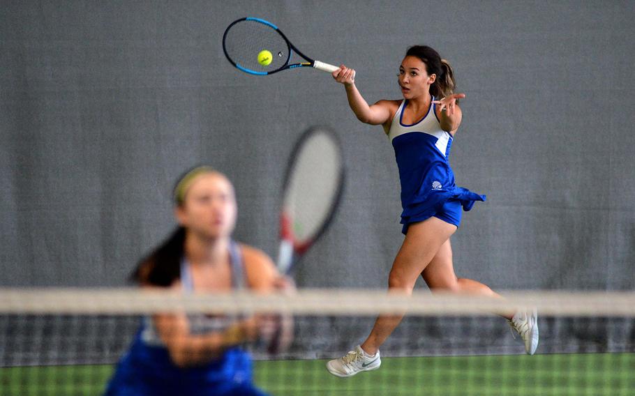 Wiesbaden's Hope Goodwin returns a Marymount shot in a girls doubles semifinal as teammate Jordan Bennett guards the net. The pair beat Francesca Buonpensiere and Eri Ishii 6-1, 6-3  to advance to Saturday's finals at the DODEA-Europe tennis championships in Wiesbaden, Germany.