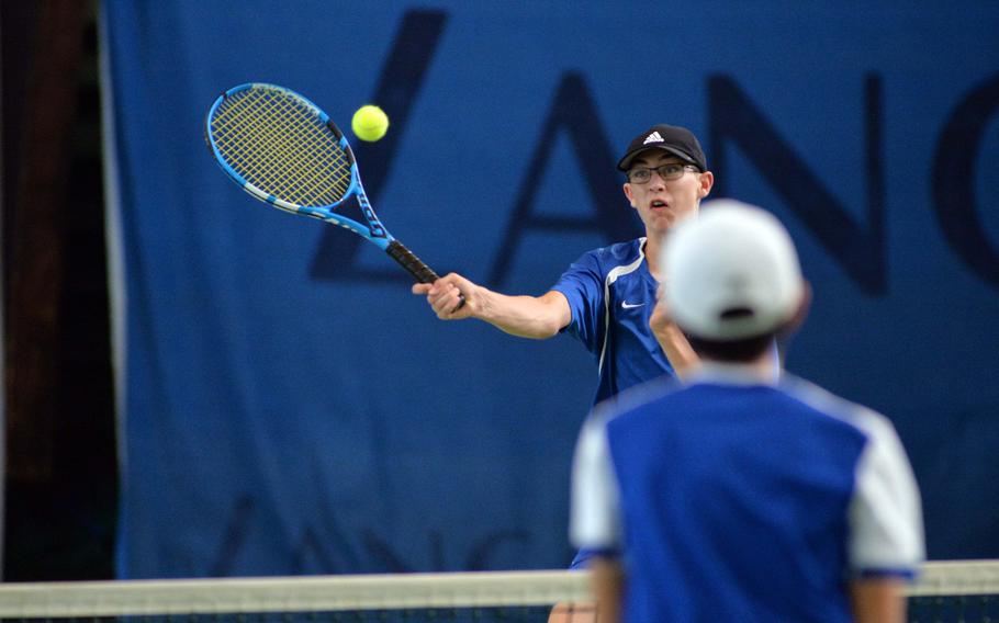 Ramstein's Colin Kent hits a winner past Wiesbaden's Yumin Kim in a boys doubles semifinal at the DODEA-Europe tennis championships in Wiesbaden, Germany, Friday, Oct. 25, 2019. Kent and teammate Troy Boehne beat Kim and Benjamin Petrik 1-6, 6-4, 6-4 to advance to Saturday's final.