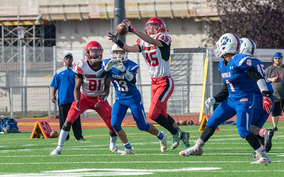 Kaiserslautern's Brice Armstrong catches a pass during a game against Ramstein High School at Ramstein Air Base, Germany, Saturday, Oct. 26, 2019. Ramstein won the game 35-21. 
