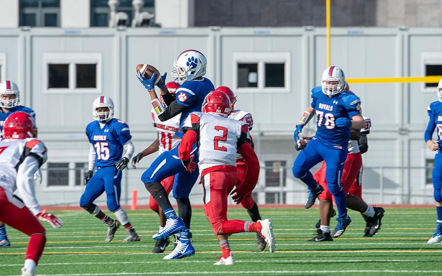 Ramstein's Jason Jones catches a pass across the middle of the field during a game against Kaiserslautern High School at Ramstein Air Base, Germany, Saturday, Oct. 26, 2019. Ramstein won the game 35-21. 