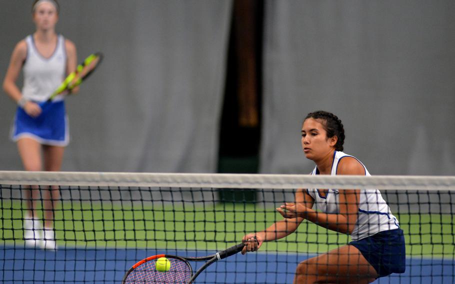 Ramstein's Isabella Guzaldo makes a return at the net against Wiesbaden in the girls doubles final at the DODEA-Europe tennis championships in Wiesbaden, Germany, Saturday, Oct. 26. 2019.  Guzaldo and teammate Dougie Allison, left, fell to the Warriors' Jordan Bennett and Hope Goodwin 4-6, 6-0, 6-3.