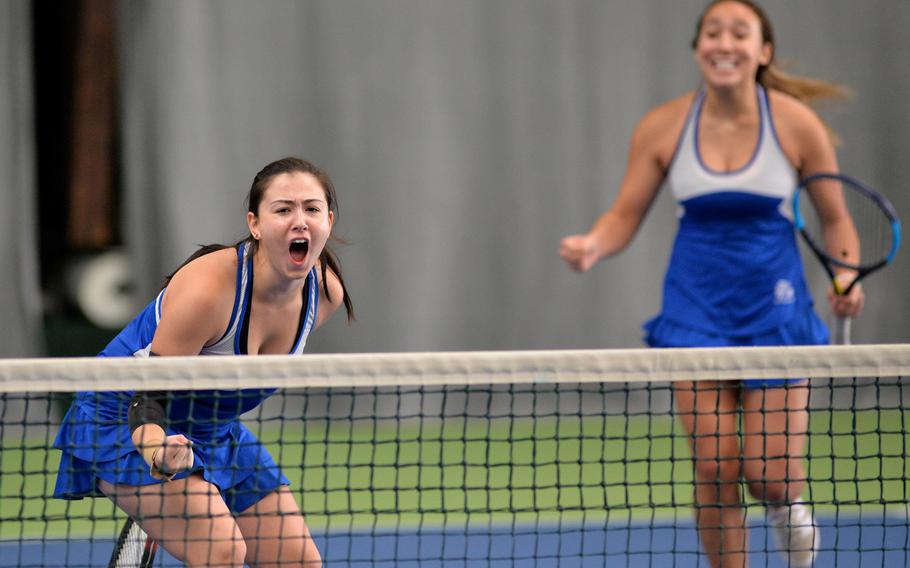 Wiesbaden's Jordan Bennett, left, and Hope Goodwin celebrate their 4-6, 6-0, 6-3 win over Ramstein's Isabella Guzaldo and Dougie Allison in the girls doubles final at the DODEA-Europe tennis championships in Wiesbaden, Germany, Saturday, Oct. 26. 2019.  