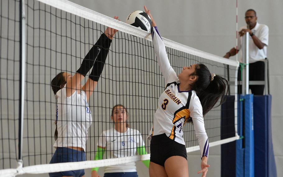 Bahrain's Nadeen Abu Aj Hal gets the ball over the net against Marymount's Federica Gentile as Nada Paoluzi watches. Marymount defeated Bahrain 25-15, 19-25, 16-14 in the Division II match at the DODEA-Europe volleyball championships in Kaiserslautern, Germany, Oct. 31, 2019.
