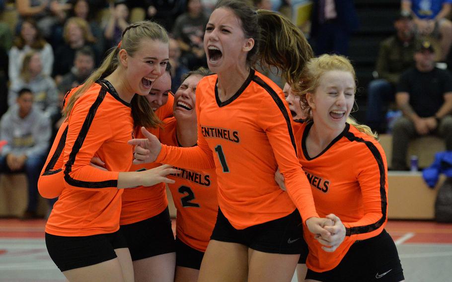 The Spangdahlem Sentinels celebrate their DODEA-Europe Division III title after defeating Sigonella 22-25, 25-12, 25-20, 26-24, in Kaiserslautern, Saturday, Nov. 2, 2019.