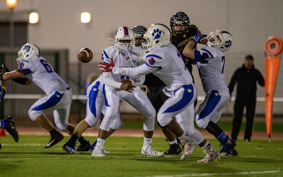 Ramstein's Carl Norman pitches the ball to Dominque Arizpe during a game against Stuttgart for the Division I Football Championship at Kaiserslautern High School, Germany, Saturday, Nov. 2, 2019. Stuttgart won the game 30-0. 