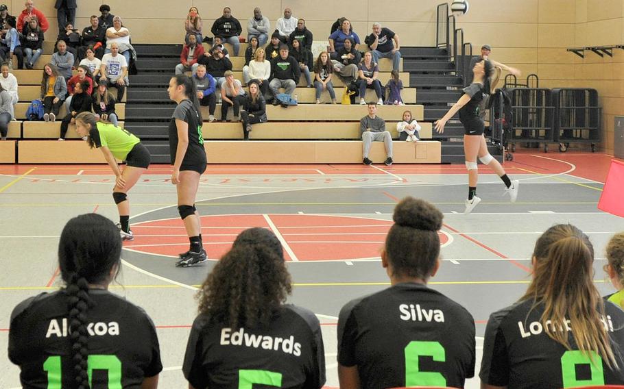  Stuttgart's Lindsey Sharp launches a serve in front of her Black team's bench in the 2019 DODEA-Europe volleyball all-star matches Saturday at Kaiserslautern High School in Kaiserslautern, Germany.