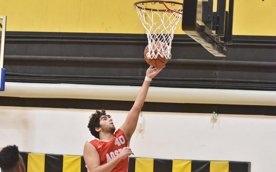 American Overseas School of Rome's Ahmed Assad puts up a pair of his game-high 26 points in the Falcons' 61-48 victory over the host Vicenza Cougars on Friday, Dec. 6, 2019.