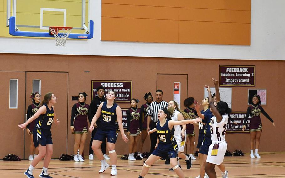 Lilly Powers from Vilseck shoots against the Ansbach Courgars during Saturday's game held at Vilseck. The Vilseck Falcons soared past the Ansbach Cougars in both girls and boys varsity basketball games.