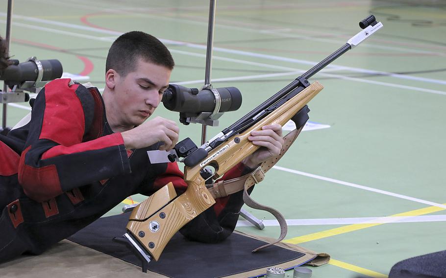 Baumholder's Jacob Gregg reloads his air rifle during a marksmanship competition held at RAF Alconbury, Saturday, Dec. 14, 2019. Competitors from Kaiserslautern, Wiesbaden, Baumholder, Spangdahlem, SHAPE, and Alconbury high schools took part in the event.