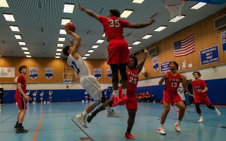 Kaiserslautern's Tre Dotson blocks a shot during a basketball game against Ramstein at Ramstein High School, Germany, Dec. 17, 2019. Ramstein won the game 72-56.
